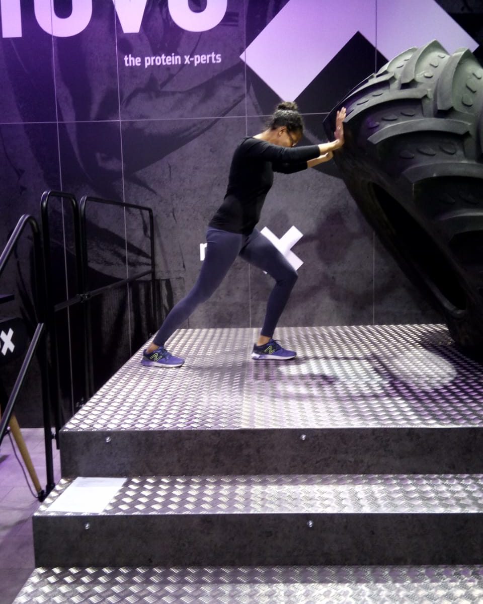 Personal Pilates Training: Nadine lifting mega-truck Tire.
